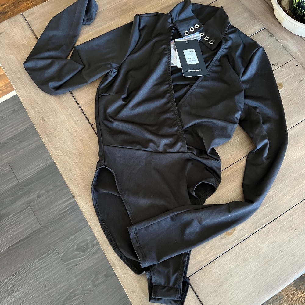 Bodysuit with safety pin neck.